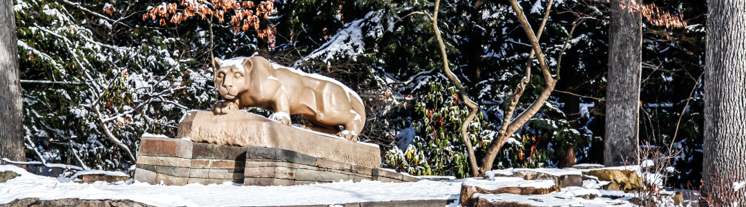 Photo of the Nittany Lion statue covered in snow