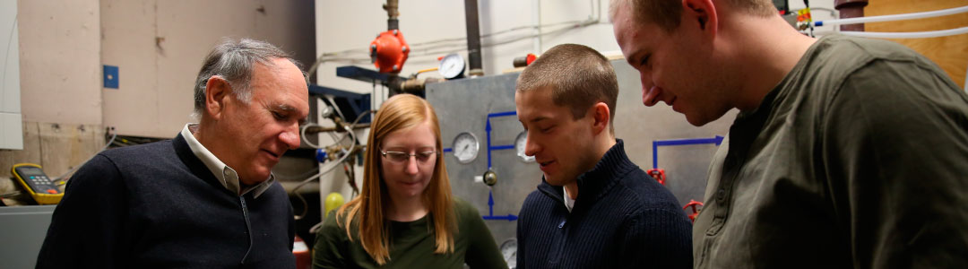 Photo of faculty member and students in a lab
